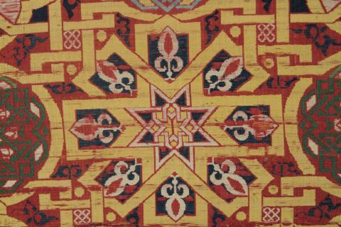 geometric deisgns in red, yellow, blue, and white, close up showing designs twithin the designs.
